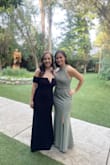 I wore this dress as a guest to a wedding and I've never received so many compliments on a dress before! I felt so cute and confident in this dress - it accentuates the bosom nicely and photographs well (see attached photo). The dress was very well made and the material was thick. The chest area is also very supportive so I didn't have to worry about my boobs popping out. I am 5'2 and I did have to get the dress hemmed a few inches. I also had the seamstress remove the straps used to hang the dress since they're in such an inconvenient spot on the dress. If they're not removed they would definitely show when wearing it. Overall, I definitely recommend buying this dress. The black is classy and I plan on wearing it again for a NYE party! - Apryl S.