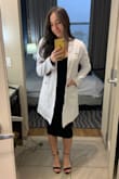 The material has some stretch to it, but is very form-fitting and flattering. I am between size S and M in dresses but I'm happy I went with the medium. This dress was perfect for my long white coat ceremony for graduating from PA school in December. Beautiful but still classy! - Jessica B.