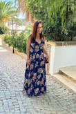 Great dress that's comfortable and appropriate for a beach or garden wedding. If you're a little bustier, would be careful about the wrap area - I couldn't keep the button there together the whole time, so ended up pinning it a bit and being a bit careful with keeping the dress tight.
The length was a bit long for me (I'm 5'5 and got a medium) so I had it hemmed a few inches. Other than that, great dress! - Lauren O.