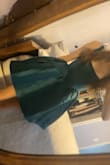 It is like a baby ball gown. The corset part is really nice and sturdy and the color is lovely. I felt like a princess all night and got lots of compliments. - Rosie G.