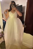 This dress is incredible! The sparkle is subtle and beautiful. The tulle layer is poofy but not too itchy/scratchy. The bodice is a nice soft material, and I think you could get away with no bra! I will still wear one, but that is just personal preference. The skirt is a little long on me, which doesn't normally happen at my height. You may need to take the hem up or wear some tall heels with it. - Kathryn H.