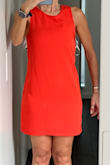 This dress looked nice for summer events or vacations, so I purchased it. It's a little confusing when you try and put it on with the straps in the back. It fits, but I would purchase a larger size because it's tight around my thighs. I have lost some weight on my thighs now, but it is still snug around my butt and thighs. Not sure if a larger size would fix that. The material doesn't give much. The material feels nice. My husband said it looked fine, but I don't like it tight and to show my thighs. Other than that, it is a nice dress. I still kept it. - Antoinette C.