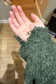 I love the look of this sweater and was saving it to wear for a work luncheon this year. I wore it for the first time today and it is coming unraveled at the sleeve. Never been worn or washed before. Very disappointed. - Carleen G.