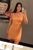 This dress is perfect for summer! Can easily go from day to night. The tassels add a little extra fun. Got lots of compliments! (It does wrinkle after some sitting but that's just the nature of the material.) - Meagan W.