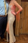 I have never felt so fabulous! Between the low neckline, low back, and slit, it definitely isn't for the faint of heart or for more conservative events. It's slinky and shimmery and just skims the ground on my tall frame. Absolutely glorious. - Julie O.