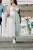 I ordered this dress for overnight delivery and it came in time for my photos. I ordered a large because of other reviews saying the armholes were kinda small. The dress was comfortable, but I wish it was a little tighter around the waist to pull me in like a corset. But it was really pretty and good quality. - Kayla K.