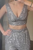 While the top did not blow me away as much as their matching pants, it's still a fun sparkly crop top. My biggest complaint is the cups can be a little saggy if, like me, you are on the smaller chested side. - Julie O.