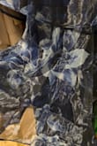 I sized up and got a medium, but it was still too tight to zip. The fit is just a bit weird. The fabric is also very shiny (see photo), so keep that in mind if you're planning to purchase. - Julia S.
