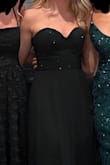 My daughter looked stunning in this dress for her high school formal. Very simple yet elegant and classy! I had to shorten it because it was too long, but the rest fit like a glove. Maybe you could offer two different lengths, petite length and regular?  Just an idea. - Kelly N.