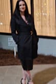 I made the mistake of sizing down based on reviews, and the split looked like it would rip. Ordered my usual size, and it fit perfectly. - Erica W.
