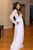 You feel like a princess in this dress.  The long sleeve details are amazing, the open back is fun and you just feel so pretty in it.  Waist area is a tad tight. - Gregory L.