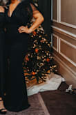 I purchased this dress for my James Bond-themed work holiday party and it was perfect! It fits like a glove and the material has some give to it so it is stretchy where you need it to be. There's not an overwhelming amount of tool like I thought there was so it wasn't over the top or felt like it was too poofy at the top where you think it's giving you extra fabric in the wrong areas, the dress was super flattering and got so many compliments. One thing to note is that the dress was a little long even wearing heels BUT you could definitely wear taller heels or scrunch up the dress in areas so that way you're not tripping, it does have a little train in the back which I loved. - Mya S.