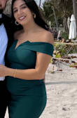 I totally loved this dress! The material is very nice and stretchy. I felt very comfortable wearing it. I am 18 weeks pregnant and still fits super nice! - Donia S.