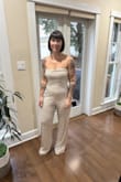 I bought this to wear to the dinner of my destination wedding in Barbados on Christmas Eve. This outfit is very comfortable, has a lot of stretch and fits great. The top stays up! It is pretty long, I didn't have much time so I used fabric tape to hem the length which worked perfectly. I ordered a medium, but it was too big. I have lost some weight recently and I am in denial of what size I am lol I can't wait to wear this in a few days after I get married!!! - Nicole W.