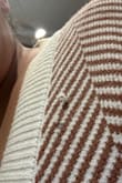 I really wanted this sweater in the red stripe but it sold out quickly so I settled on the brown. The sweater is very thick so it will keep you warm in cold weather. I live in California so it's great for being outside in the winter without needing a coat during the day. The arms are a bit too long so it makes the shoulder/arms look a bit bulky. My biggest complaint is that the material snags easily - it snagged and started unraveling after just one wear (no washes). - Mary A.
