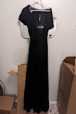 The dress was nice but too small. The material was thinner than expected. The tags are all still in. Never worn. - Emily R.