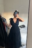 Although I bought a Large because the sizes were out, it fit perfectly! It does tie in the back so that helped a lot!! Size Large fits close to a Medium if you need this dress ASAP. - Alycia E.