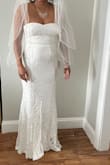 Put it on and it fit me nicely. I don't have hips so finding dresses that look good are not easy. This one is great even without hips! Perfect length. I did not have to get the dressed hemmed at all! - Monica W.