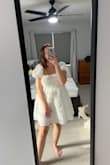 I adore this little dress! It has such a cute floral texture, is not too short, and is true to size. I got it for my bridal shower in May - it is a cute spring cupcake dress. - Kasey D.