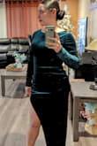 I wore this dress for a Christmas party. It is a very beautiful color. The slit it pretty high, but I wore some black spandex shorts under to make me feel more comfortable with the dress. It is stretchy. The quality is great. - Anailee M.