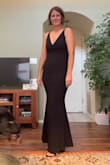 This was a great black dress. The material is stretchy; although it's still very fitting, you remain comfortable. I'm 5'11 and I wish it was 1" longer, but oh well. - Claire S.