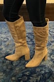This would be a lot better if the shaft had a section of stretchy elastic, that would fit to the calf a little bit better. As it is, the shaft was just too big and bulky for my legs. The boot itself is super cute, and I wish it would have fit. I thought about taking them to a tailor and having the material sewn to be more formfitting to my calf. I normally wear a 9 to 9.5 and ordered a 10 which was the right fit. - Manotee C.