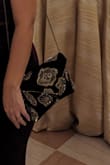 Beautiful purse. On the light you can see the blue but at night is can easily pass for black - Veronica C.