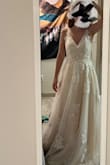Too long for me, but this is a good enough deal I could afford to have it altered. The lace is really feminine and classy - pretty without too much bling. The back clasp is really fragile so that needs to be reinforced based on your shoulder/bra size. Loved it and excited to get married. :) - Emily B.