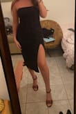 I love this dress, it has a corset top that really cinches the waist. The strapless top has some rubber lining that helps it stay up. I love the way the slit falls over the front of the thigh. Nice thick material. - Nikki S.