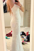 I really liked the fit of this dress - maybe a little more flattering if you have thinner hips than mine.:) The front and the lace up back are very sexy - just a little too much for my conservative family at my wedding. Otherwise loved it. - Emily B.