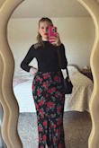 I'm in love with this skirt and have no second thoughts about buying it. I started out with a small but exchanged for a M and it fits more comfortably. I bought the matching top and am in love with both. I got lots of compliments. I will say the material is thin and will need Spanx, a short slip, or leggings/tights. The buttons with the slit are adorable and there's a side zipper and elastic waist. - Lauren G.