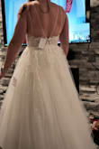 It was beautiful and giant like a princess with a train. I loved it but it really cut into my armpits and the straps were uncomfortable. The chest area was too tight and hard to breathe as well. However, it's absolutely gorgeous and I would have gotten it in a size larger but liked another dress better. - Adri M.