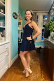 I bought two of these dresses, one in blue size small, and this one in medium. This one fits bigger but still fits. This will be a great evening out dress! I wore the blue one for the wedding. - Kami R.