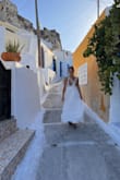 I bought this dress for a trip to the Greek Isles in September. It is absolutely perfect. I originally ordered a small but returned it because it was too big. The extra small was a little bit long for my athletic build 5'4 but worked great with a tiny kitten heel. Overall, it made me feel like a boho princess, matched the setting of tiny alleyways and the white-washed stairs of Santorini, and is the most perfect dress I could've worn the night my partner proposed to me. Buy this dress. - Vanessa S.