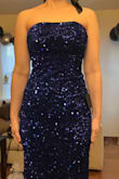 I read the previous reviews and sized down to an extra small. The shimmer on the sequins was beyond perfect! I love this dress so much. I highly recommend purchasing it. - Leslie H.
