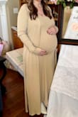 I wore this when I was 8 and 9 months pregnant and I LOVED it!!  So stretchy, soft, and comfy!  I'm normally a medium and sized up to a large to fit my belly.  The sleeves were a little long on the cardigan, but I would not have sized down.  Definitely order this one!! - Rachel F.