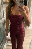 I received so many compliments on this jumpsuit. The material is soft and stretchy and the top of the jumpsuit fits like a corset but the back straps are stretchy so it feels very comfortable. - Johanna F.