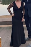 Hugged my curves in all the right places! I probably could have worn a Medium, but it wasn't in stock so I ordered the small. The quality of the material was thick, smooth, and didn't show any lumps or bumps. I wore platform heels and was able to get away without hemming the dress -which was a huge win. The tulle sleeves weren't itchy at all. Definitely a great addition to my formal options. - Sarah C.