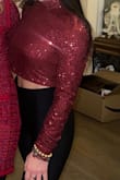 Beautiful and just as pictured but it snags on everything. I wore it for Christmas and any time I'd lift my arms up the material snagged on the arm sleeve and the side of the blouse, essentially ruining it. - Chrissy F.