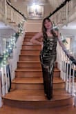 Wore this dress to a NYE wedding and received many compliments! It fit like a glove, and I felt great in it! It's more copper in color than black, but I prefer that actually. - Lisa C.