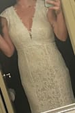 I bought this dress for my reception dress, and it's absolutely gorgeous. The material is outstanding. The lace is a classic. I read the reviews and figured a small would be fine, but because of my chest size, it would not zip. I traded for the Medium, and it fit perfectly. - Danielle J.