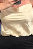 They lined only the front of the bodysuit, and only the bust area, with an extra layer of material. I think that probably works great in the darker colors but not in the ivory. It gives the light coverage you need to be able to not wear a bra but then you can see the piece of fabric and the seam which creates a line and it just looks so bad and cheap. The straps are also made of the same material and I wish they were made with the same stretchy material as their red and olive green cowl neck bodysuits, it just holds up better and this one tends to have the straps slip off your shoulder more easily and fall down. This was a return for me :/ - Jenna F.