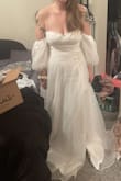 As soon as I tried this on, I started bawling like a baby. It took so much stress off being able to try it on at home and I love it so much. The sleeves are my favorite part and it fits perfectly (I'm just short so I'll have to get it hemmed an inch or two). I may add more structure to the top because I have a bigger chest than the models do, but it's not necessarily needed. Plus, with the money I saved on this dress, I can afford adding boning to make it perfect. I can't wait till I actually get to wear it down the aisle. - MacKenzie W.