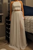 Overall, I love the top and think this is a cute two-piece set. The top's lace is soft and comfortable, making me want to wear it all the time. The skirt came wrinkled so I had to steam it, no big deal, but that was when I noticed a tiny black dot on the back. You can't really see it while on, but I'm disappointed with that. Oh, and it came with a black garment bag, which is a nice perk. Will definitely need hemming though - Elizabeth C.