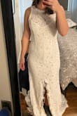 I really liked the shape of this dress and the quality of the lace. However, it will be going back because the lack of structure in the bust makes me look very shapeless and the slit down the middle (not off to the side) is a weird placement. Ordered size L but would need to size up if I were keeping it. 5'4", 36 bust, 29.5 waist, 41 hip. - Melinda H.