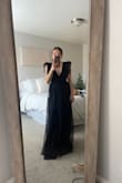 This dress is beautiful. It fits me perfectly, hugging all the right places. The sleeves MAKE this dress, making it so elegant and perfect for any black tie event. Such an affordable option and something I will use as a bridesmaid, but also for other events as well. - Mckenna