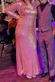 The dress fit perfectly, and I received many compliments on it. It was also very comfortable. The sequins do tend to fall off and get snagged on things, but overall, a great purchase. It is a little more of a regular gold color rather than rose gold. - Mari K.