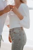 Absolutely LOVE this top. The back bow can be made tighter of you like a better fit. Thong is super soft and comfortable. Would definitely recommend!! - Nicole H.