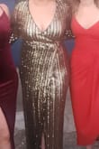 I wore this dress to a NYE wedding and received so many compliments! The dress is extremely well made and held up through a night of dancing. It has a tiny bit of stretch and was very comfortable. I felt beautiful in this, highly recommend! - Kelli M.