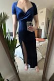 I know I'm tall but I feel like the slit was WAY too high. Maybe it hits lower for shorter girls. Also hits above my ankles so it's definitely a shorter dress. The material was really stretchy so you can size based on how you want it to fit. Plenty of room in the chest for bigger-chested ladies. - Dorothy-Faye S.